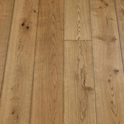 An image of coyote plank flooring. The planks exhibit a medium brown colour with rich wood grain textures, offering a rustic and earthy aesthetic.