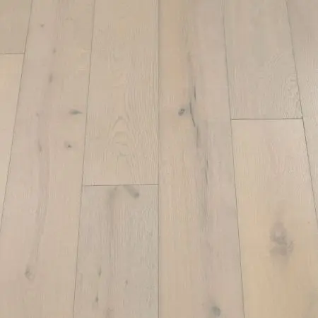 Glacier Plank: Detailed view of Jordan's Woodflooring in Glacier, featuring cool, icy tones with a smooth, pristine surface.