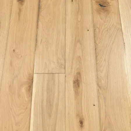 A smooth plank wooden floor in a misty gray tone. The planks have a uniform width with a slightly weathered look, providing a contemporary feel. The subtle grain pattern and muted colour make this flooring ideal for minimalist or Scandinavian-style interiors.