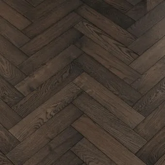 Carbon Herringbone Flooring: An up-close photograph of carbon-coloured herringbone patterned flooring, characterized by deep charcoal hues, adding depth and sophistication to interiors.