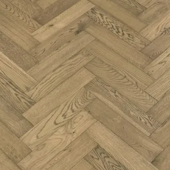 Silk Herringbone Flooring: An image of silk-coloured herringbone patterned flooring, featuring delicate beige tones and a smooth satin finish, offering a sophisticated and versatile option for various interior styles.