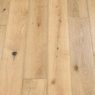Shandy Plank Flooring: A detailed photograph of shandy-coloured plank flooring, with light golden hues and a textured surface, adding warmth and character to living spaces, ideal for a welcoming and cozy home environment.