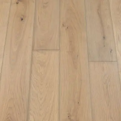 Taupe Plank: A close-up of Jordan's Woodflooring in Taupe, highlighting rich, earthy tones and the natural texture of the plank, perfect for a warm, inviting space.