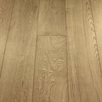 An image of Wide Pyrite plank flooring by Jordan Wood Floors, displaying dark grey tones with metallic undertones and intricate wood grains, suitable for creating a dramatic and modern look.