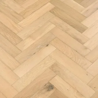 Shandy Herringbone Flooring: An image displaying shandy-coloured herringbone patterned flooring, featuring warm golden hues reminiscent of the popular beverage, adding brightness and cheerfulness to rooms.