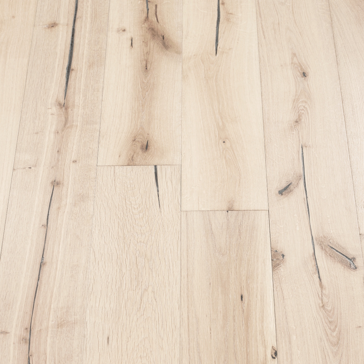 Alpine Distressed Wood Flooring: A photograph displaying distressed alpine wood flooring with whitewashed tones and distressed textures, evoking a sense of rustic elegance.