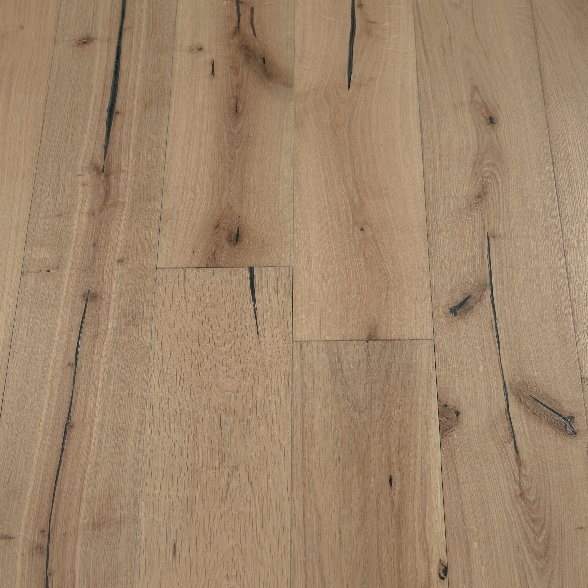 Ash Distressed Wood Flooring: An image showing distressed ash wood flooring with light grayish-brown hues and subtle wood grain textures, ideal for modern and minimalist interiors.