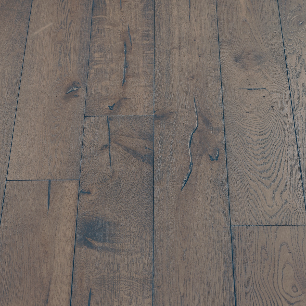 Boulder Distressed Wood Flooring: A photograph showcasing distressed boulder wood flooring with rugged textures and earthy brown tones, perfect for rustic or industrial interior designs.