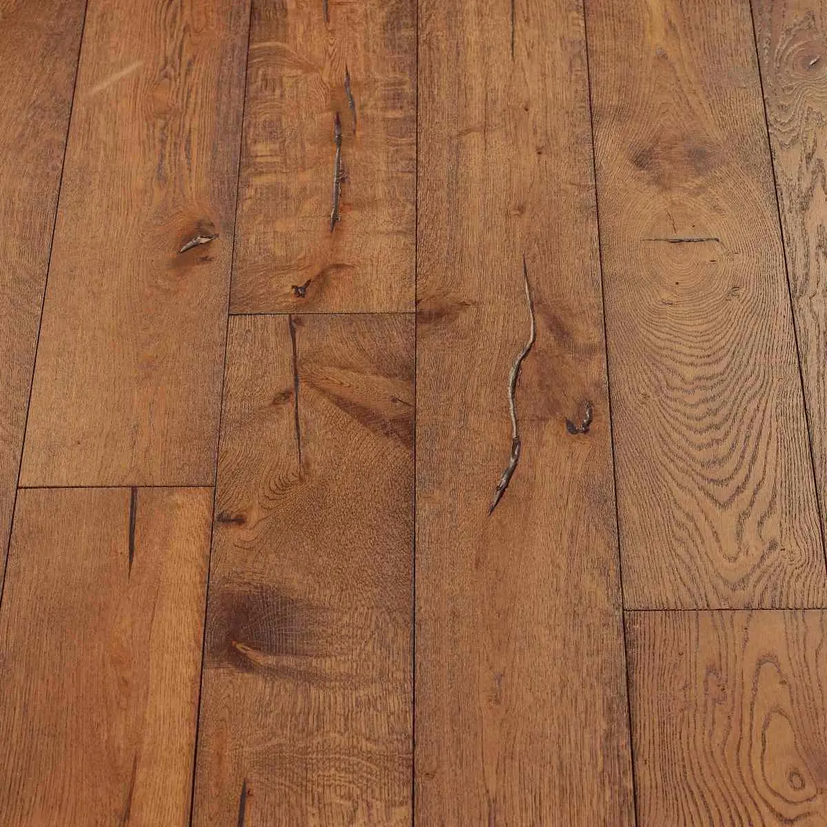 Distressed Mahogany Flooring: A close-up of distressed mahogany flooring, exhibiting a warm reddish-brown hue with distressed patterns, offering a classic and timeless aesthetic.