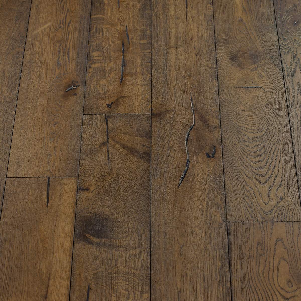 Distressed Mocha Flooring: An image showing distressed mocha flooring, characterized by its rich brown colour with distressed markings, adding depth and texture to the surface.
