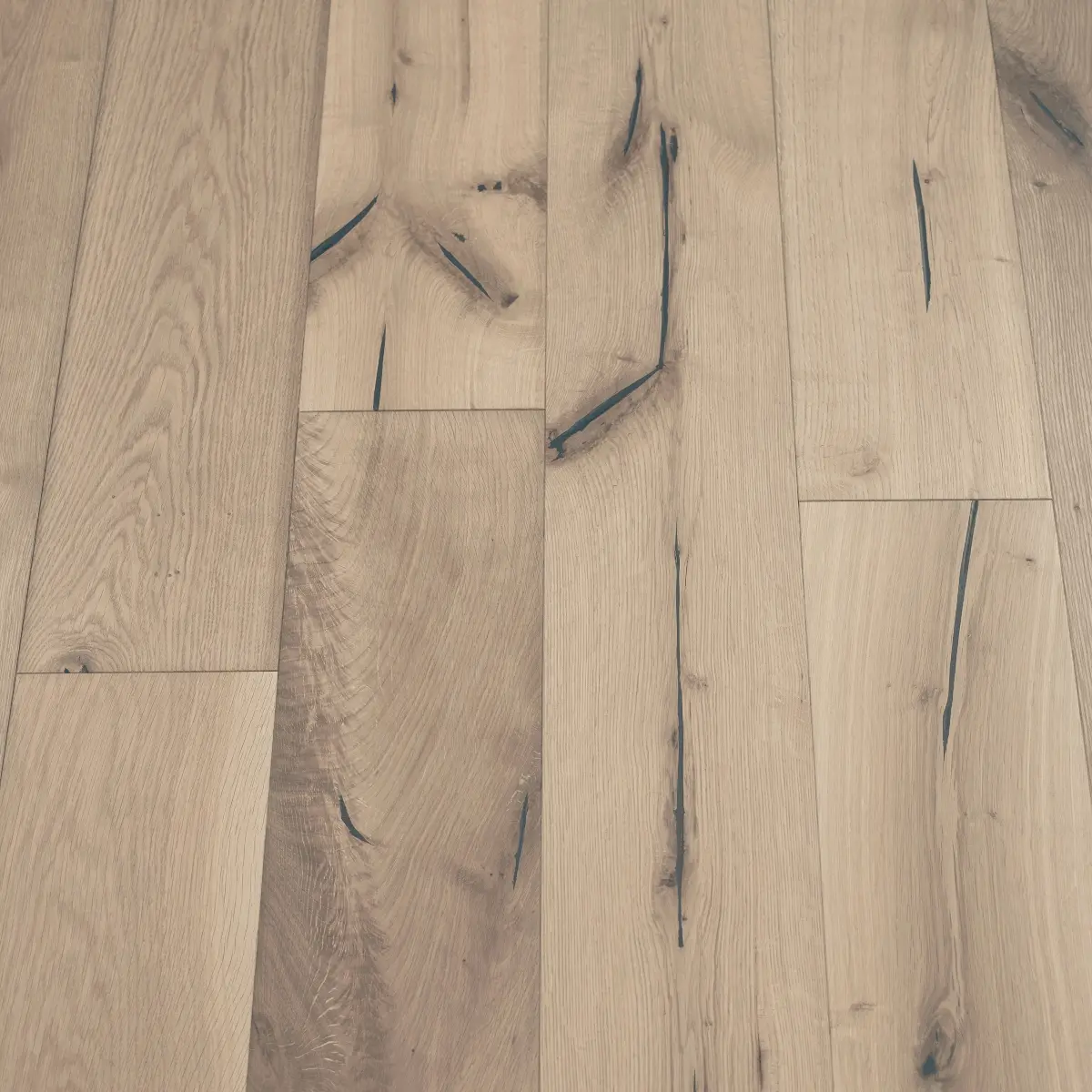 Distressed Moonstone Flooring: A close-up view of distressed moonstone flooring, featuring a soft, muted gray hue with subtle distressing for a rustic look.