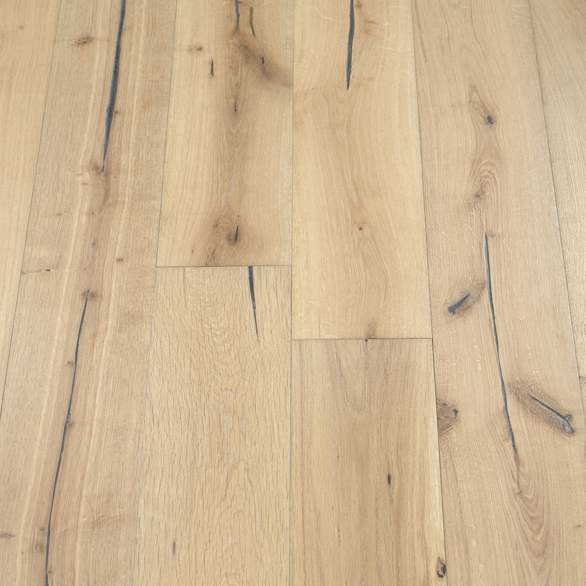 Distressed Pebble Woodflooring - image showcasing distressed pebble-colored wood flooring with a neutral and calming palette, creating a versatile and timeless look.