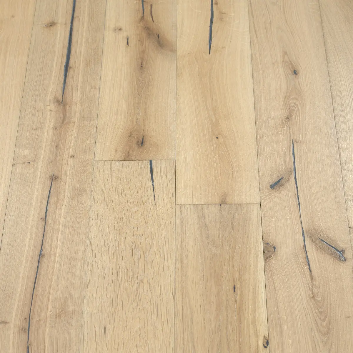 Distressed Pebble Woodflooring - image showcasing distressed pebble-colored wood flooring with a neutral and calming palette, creating a versatile and timeless look.