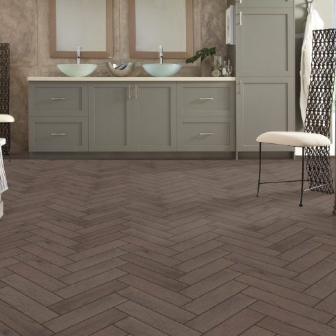 A simple, grayscale icon symbolizing grey herringbone flooring, potentially representing a product category or selection filter on Jordan Woodfloors’ website.