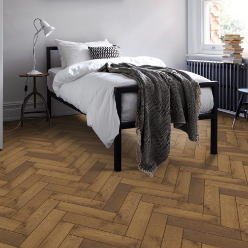 A graphical representation of light-stained herringbone flooring, likely used as an indicator for a product category featuring soft, natural wood tones.