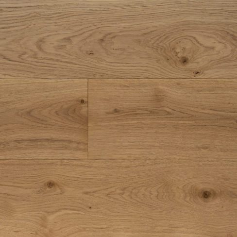 A top-down view of Universal Clic Brushed Oak laminate flooring swatch, characterized by soft, neutral wood tones with a lightly brushed texture. The surface mimics the natural wear of real wood, enhancing its authenticity and charm.