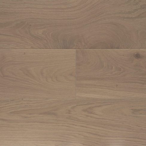 A top-down view of Universal Clic Embleton Oak laminate flooring swatch, showcasing mid-toned oak hues with intricate wood grain details. The subtle texture and refined finish create a balanced and versatile look suitable for both modern and traditional spaces.