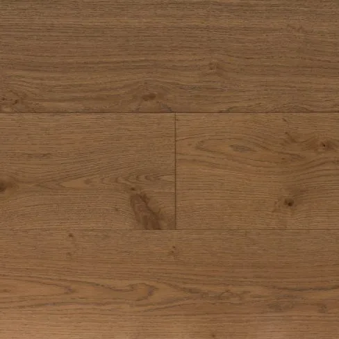 A top-down view of Universal Clic Harvest Oak laminate flooring swatch, featuring warm golden-brown tones reminiscent of freshly harvested oak. The visible wood grain adds depth and character, making it a perfect choice for classic and rustic interiors.